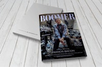 the cover of boomer magazine on a wooden table