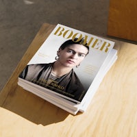 the cover of boomer magazine on a wooden table